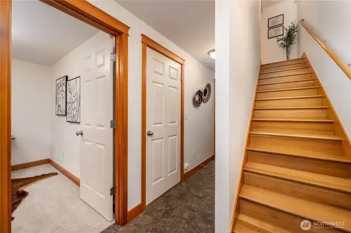 Just inside the front door. The seller upgraded the home with hardwood stairs.