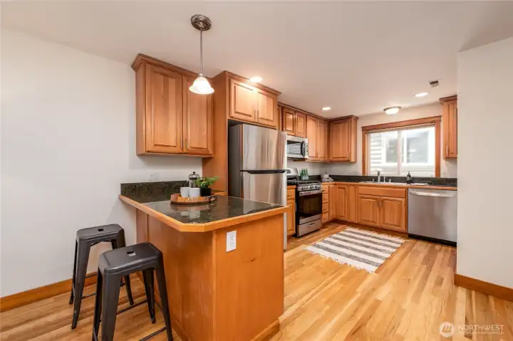 Open kitchen with newer appliances is perfect for entertaining.