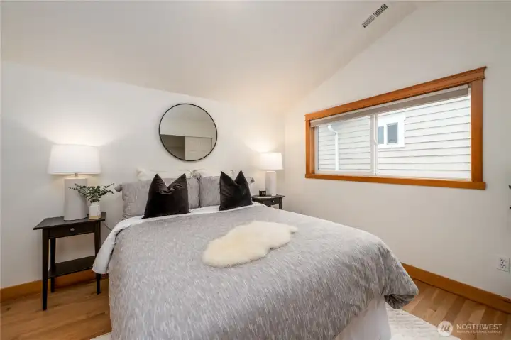 Second bedroom upstairs, also with vaulted ceilings and hardwood floors.