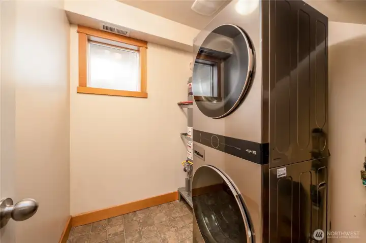 Dedicated laundry room fits full-size laundry with room for extra storage!
