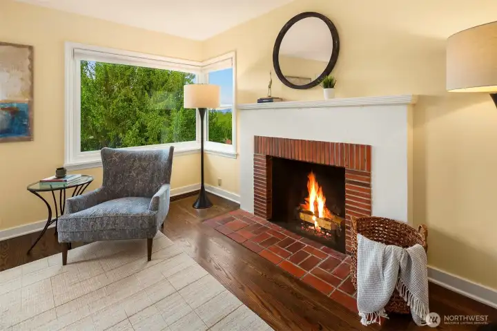 Living room fireplace and east-facing windows create warmth and visual rhythm.