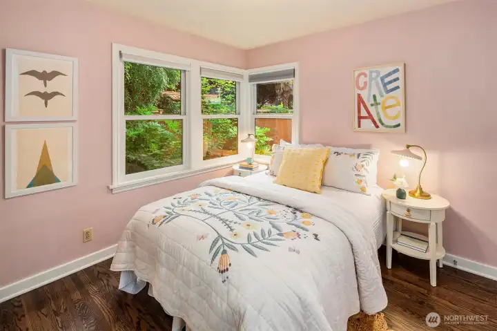 Main-level bedroom with peaceful garden outlooks and soft eastern light.