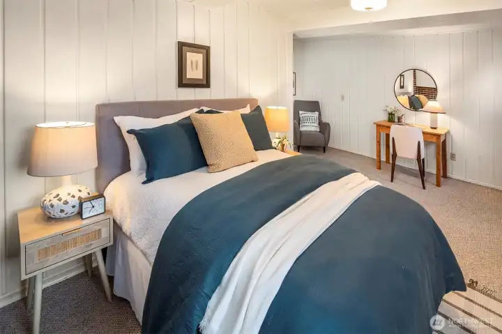 Spacious lower-level retreat area adaptable for office, hobbies or storage.
