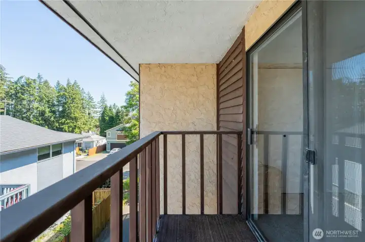 Private balcony off the primary bedroom with peaceful territorial views.