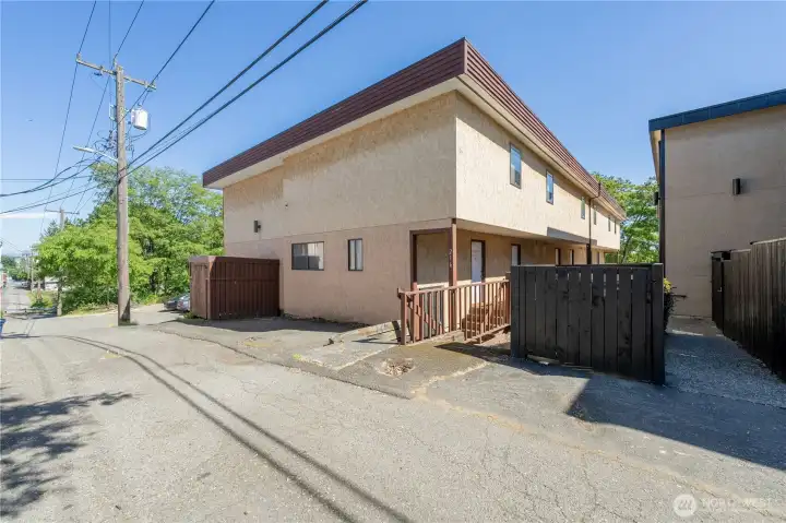 Townhome style 6 unit condominium building with private entry and convenient alley access.