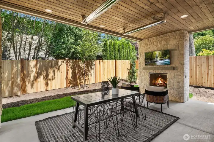 Outdoor covered living area with fireplace