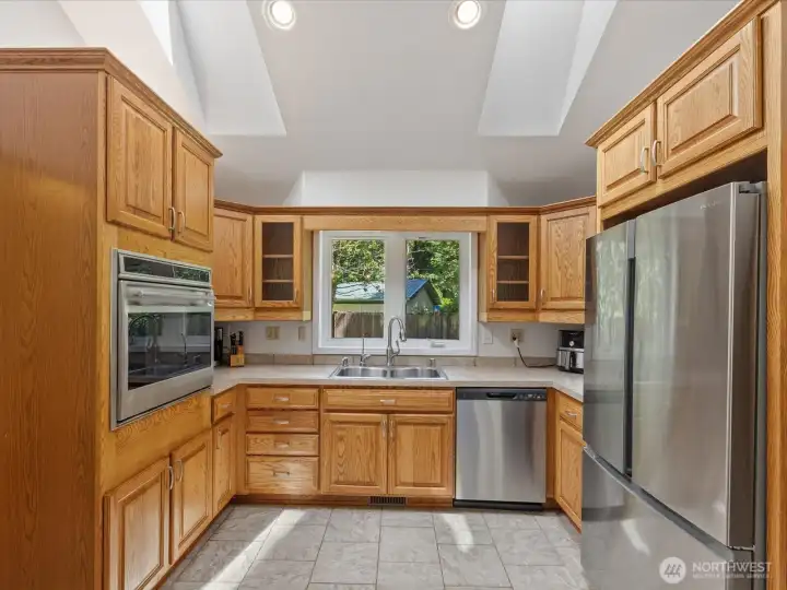 Quality cabinetry and appliances. Skylights keep the kitchen light and bright.