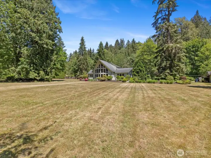 Huge open, sunny yard, ready for play, garden, entertaining.