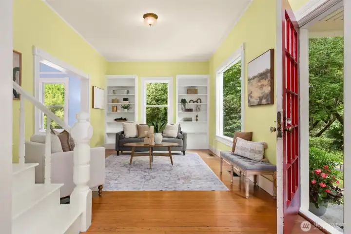 Inviting living room with built-ins and large windows for fabulous natural light.