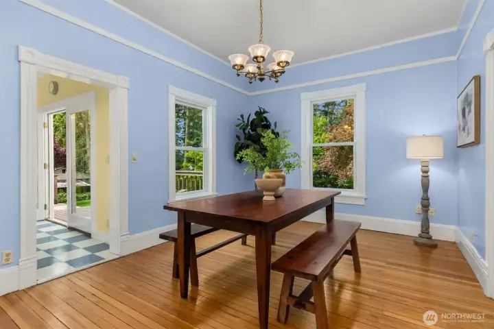 The den and living room flow into the dining room.
