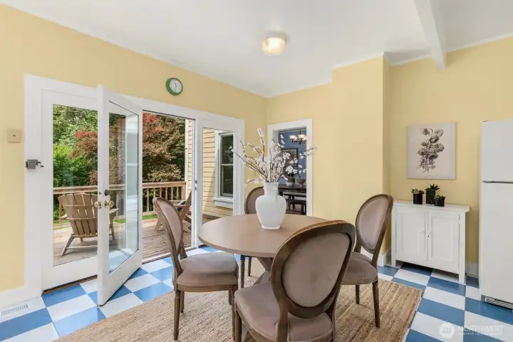The kitchen opens to a deck with stairs to the yard.