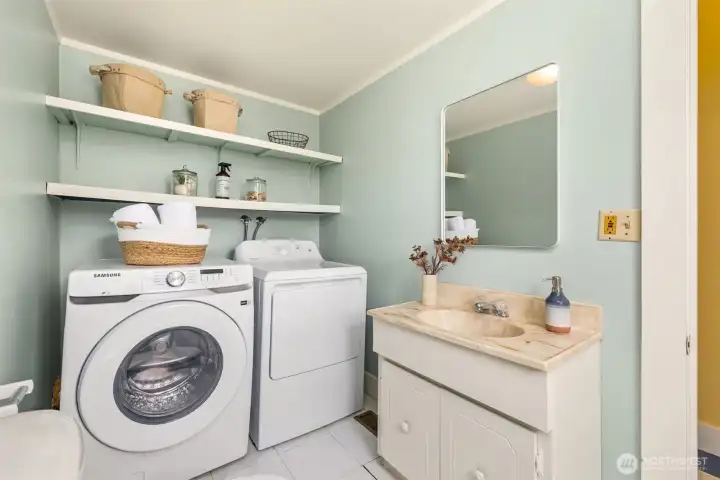 Back on the main floor, the laundry room includes a half bath.
