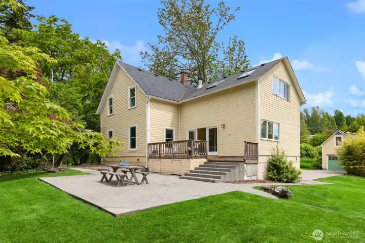 Outside, the back yard enjoys a large patio space and lawns.