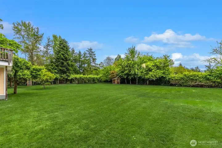 A garden/play shed sits on the east corner of the property.