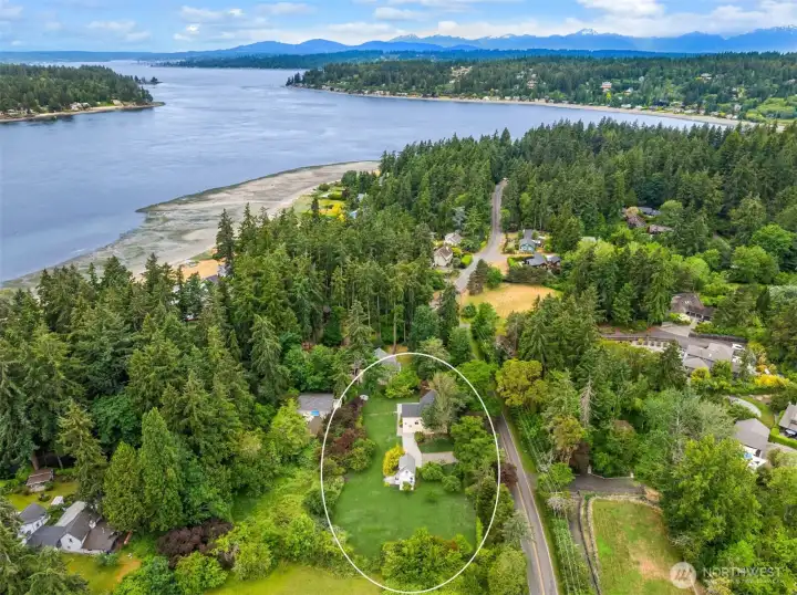 View from above looking west and showing Lytle Beach and Pleasant Beach with Puget Sound and the Olympic Mountains beyond.