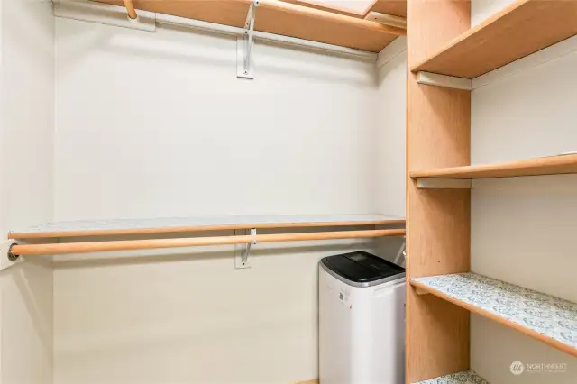 Built-in clothes hangers and shelves provide ample storage.