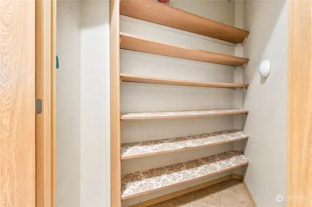 Walk-in angled pantry for all of your non-perishables.