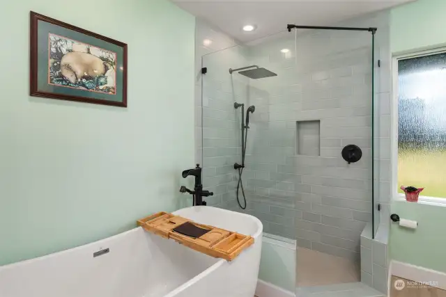 Freestanding soaking tub and large walk in shower.