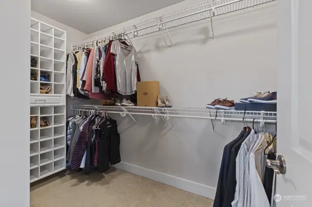Walk-in closet with more storage than shows