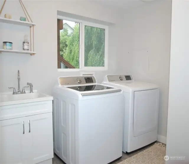 Large laundry room with a wash sink. Washer and Dryer included!