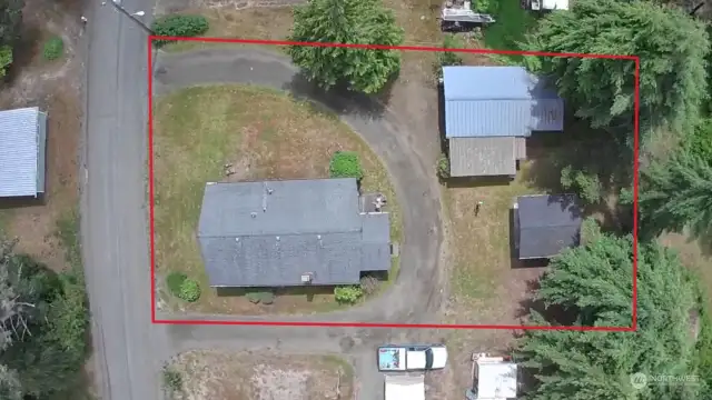 Approxamate property lines. Neighbor to the N. shares the N. driveway