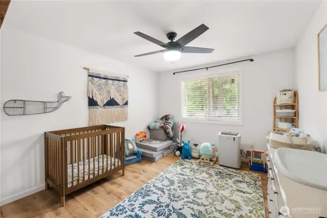 3 nice sized bedrooms provide spaces for rest and play. This room includes a decorative ceiling fan light
