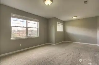This bonus room is ready for whatever you throw at it. With tons of space, plush carpeting, and two large windows bringing in the natural light, it’s perfect for a multigenerational living setup with studio-style vibes. Or transform it into a second-story gathering area, game nights, crafting, or just relaxing together. The wide slat blinds give you the option for privacy when needed. Whether it’s a playroom, office, or cozy retreat, this space can truly be whatever you want it to be.
