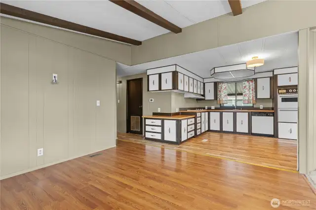 Antother view of seating/tv room and kitchen.