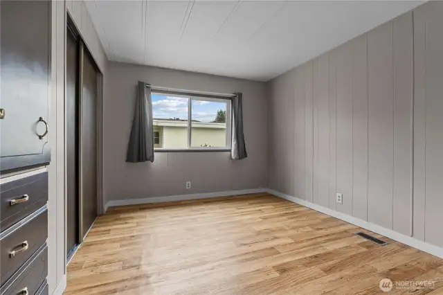 Second bedroom has been freshly painted and has new flooring.