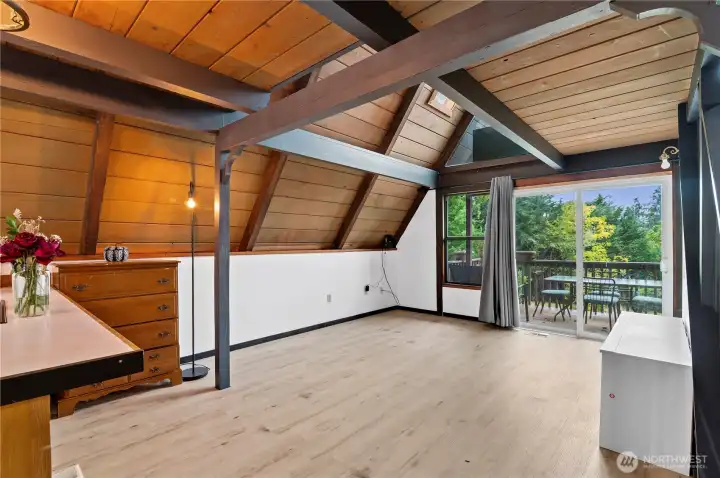 Vaulted ceilings + wall of windows = endless natural light inside this Camano Island getaway.