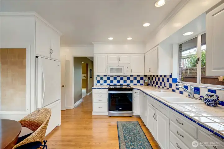 Spacious kitchen with breakfast nook that look out to backyard.