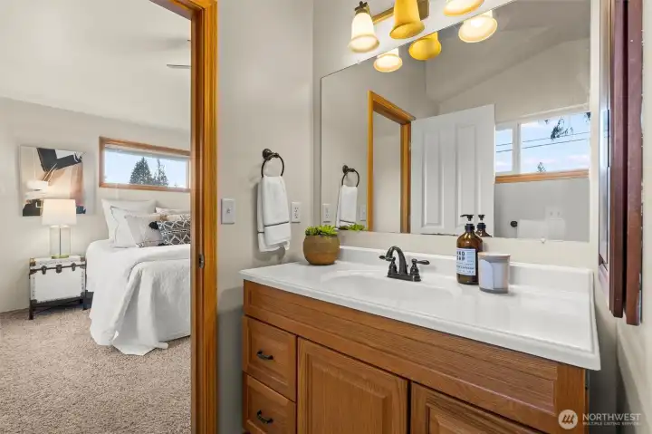 Primary bath features tub and tile surround shower.