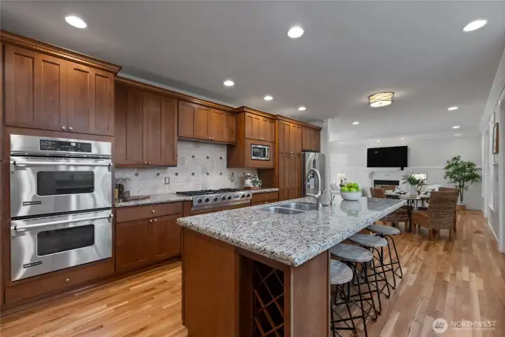 Double oven, gas 5 burner cook top are any cook's dream! Not only do we have a breakfast bar, but also a large eating area between the kitchen & family room.