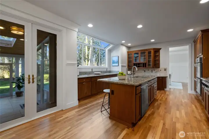 To the left are French doors leading to the amazing sunroom! Harwood floors are stunning.