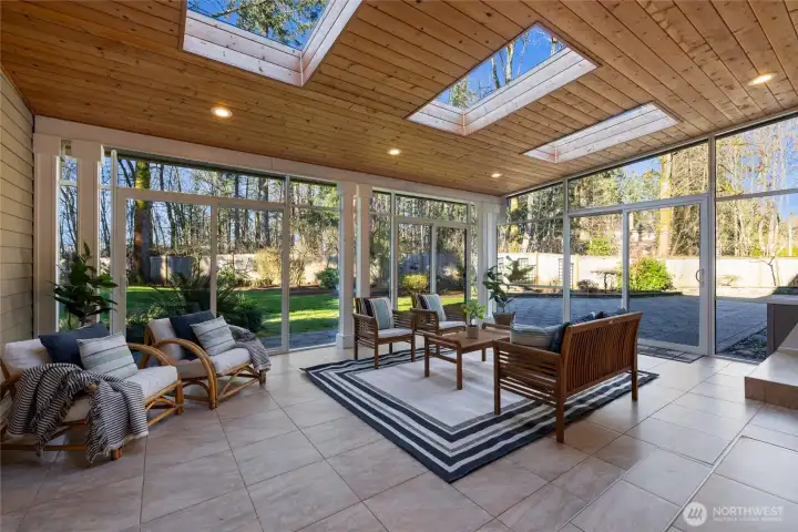 Truly "inside/outside living!" Enjoy this sunroom year round! Beautiful wood ceilings offer warmth & character. the awesome skylights bathe the entire area in natural light.