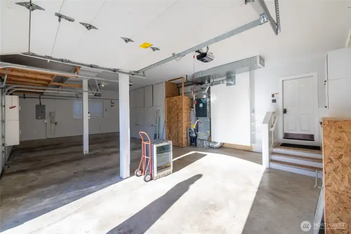 3 car garage with storage cabinets and shoe cubbies!