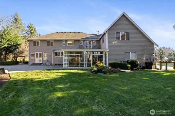 Notice the large patio area and level backyard! The Sunroom adds indoor/outdoor living space year round!