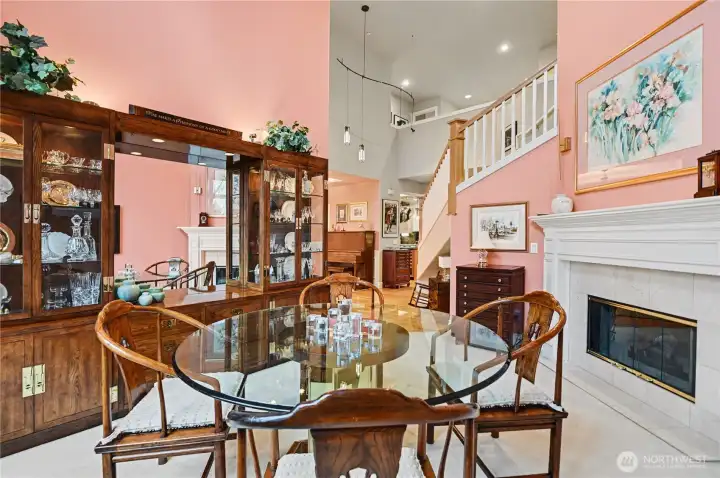 Elegant formal dining room to the right of the entry features a cozy gas fireplace.