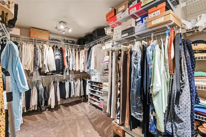 Spacious primary walk-in closet provides ample storage for all your wardrobe needs.