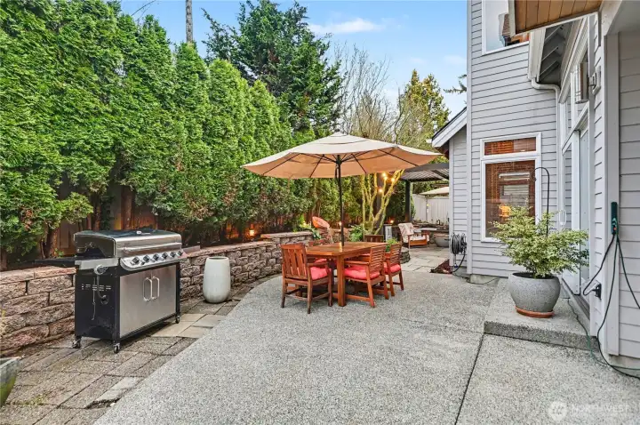 The fully fenced backyard is a private, beautifully cultivated retreat.