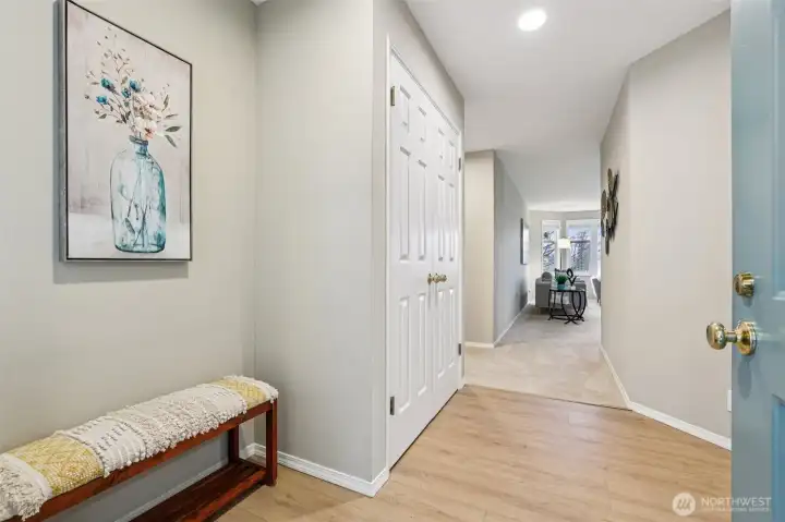 Lovely newer vinyl plank flooring at entry foyer