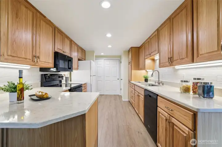 Hard surface counters, updated backsplash, updated cabinetry