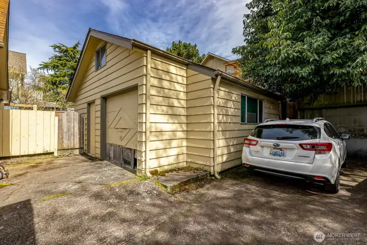 Detached one car + garage with electricity.