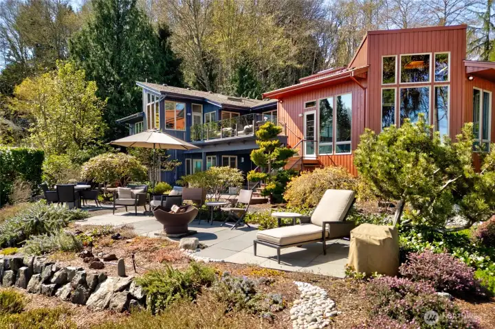 Landscaped patio with seating and garden views