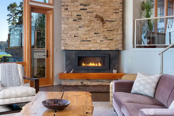 Living room with stone fireplace and wood beams