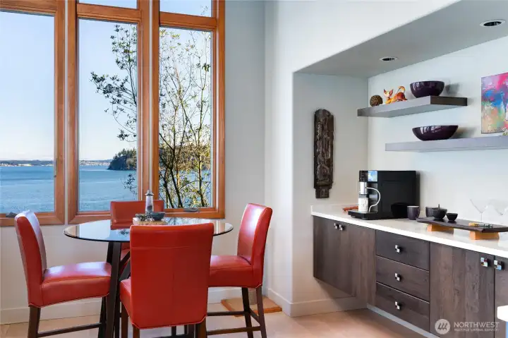 Dining nook with large windows and water views