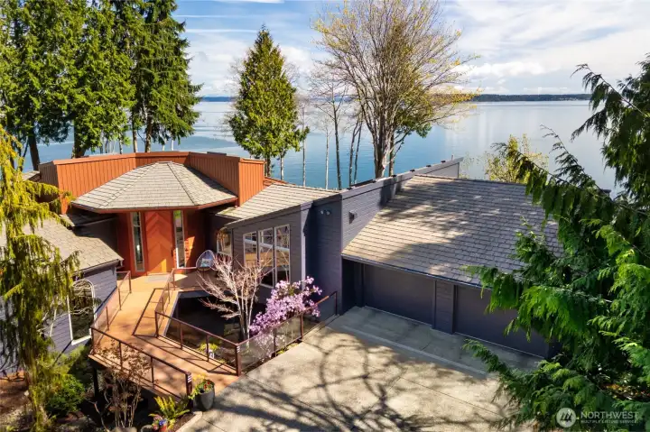 Aerial view of modern home with ocean backdrop