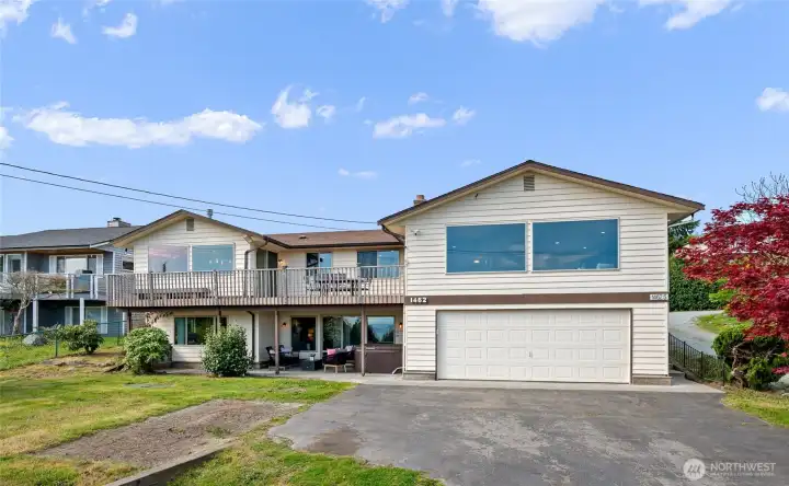 Huge driveway with attached 2 car garage