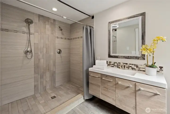 With a huge walk-in shower with double shower head
