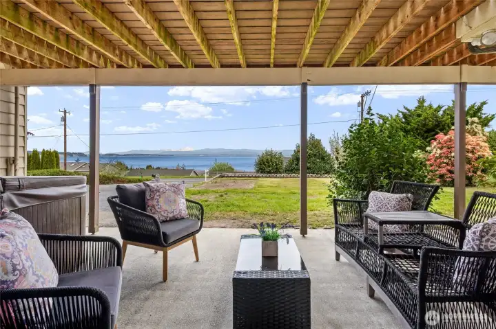 Lower patio where you can unwind in the hot tub or soak in the views!